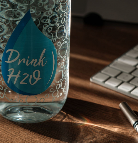 Free water intake calculator showing daily water target in liters, cups and ounces